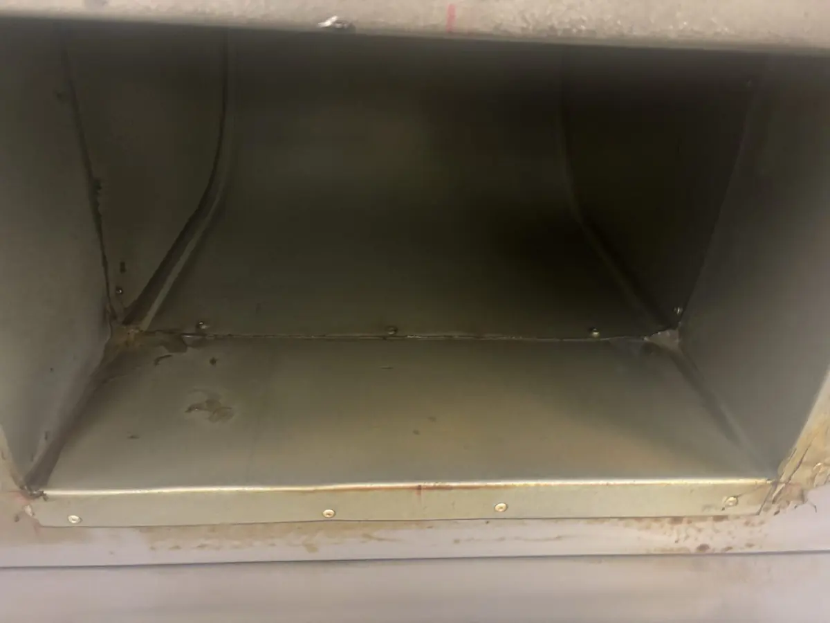 Interior of a commercial kitchen canopy plenum after degreasing