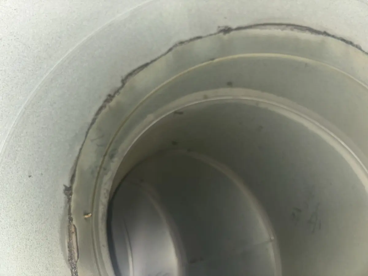 Circular kitchen extract ductwork interior after grease removal
