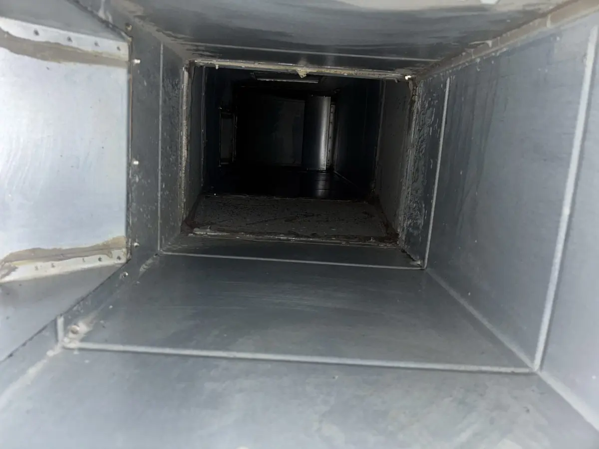Kitchen extract ductwork access panel interior after cleaning